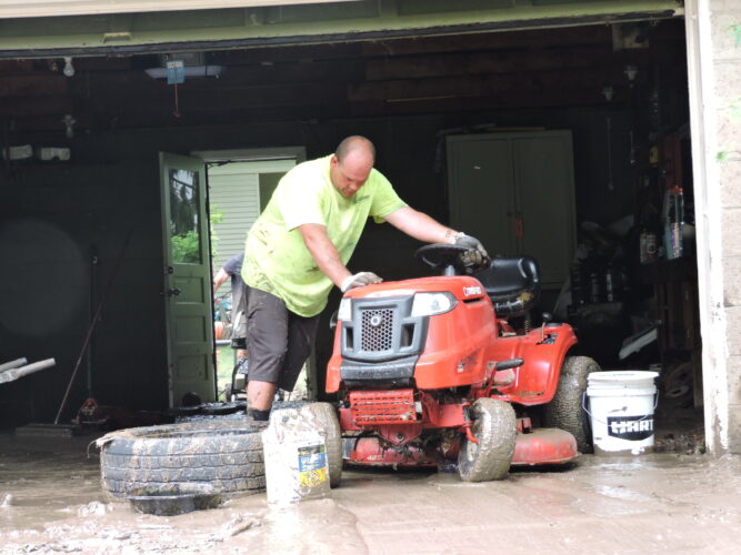 Woodsdale Residents Sift Through Mud, Debris